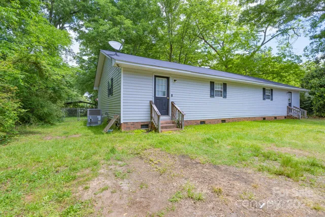 a backyard of a house with seating space