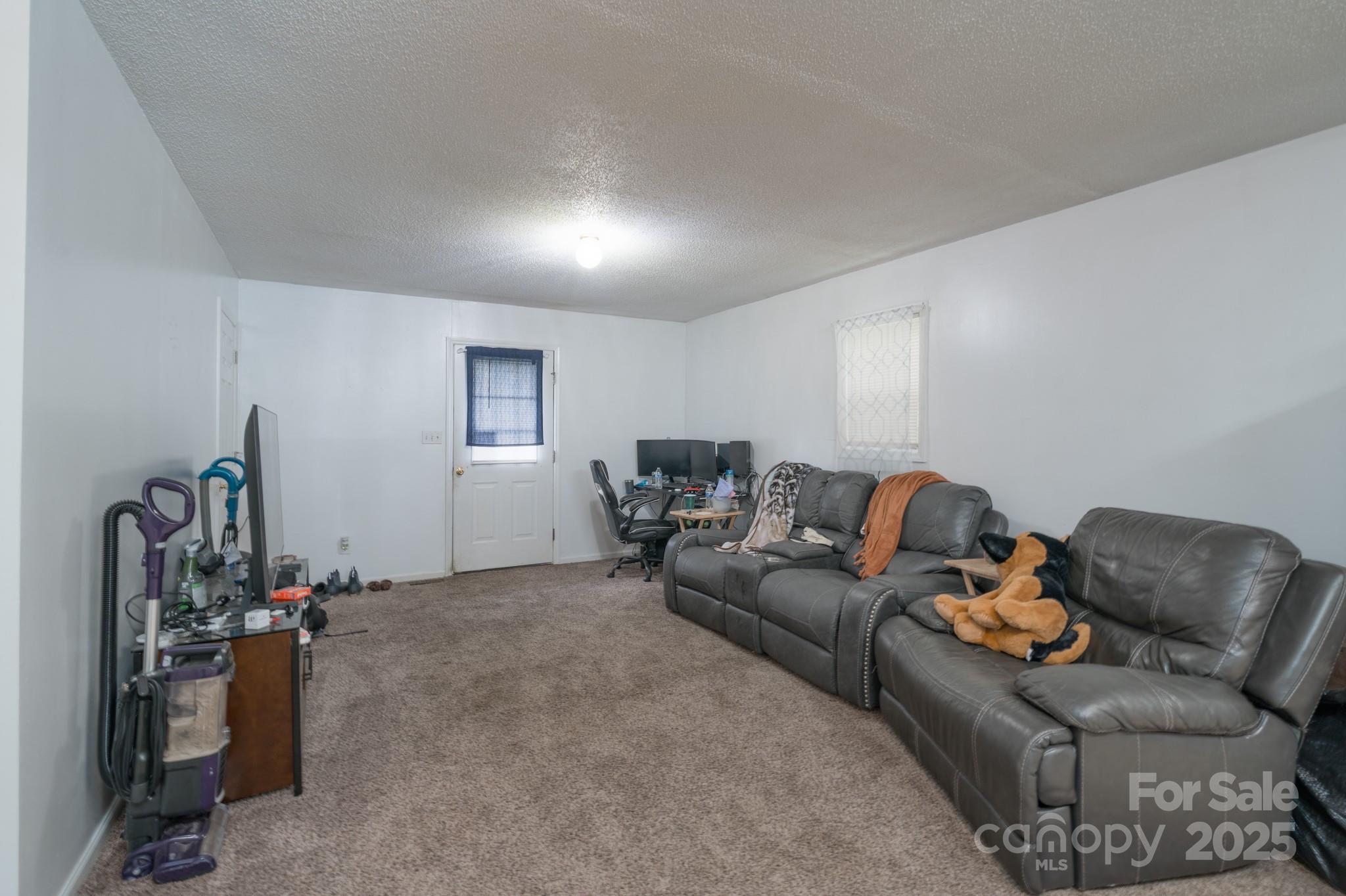5624 Pleasant Avenue, Unit 3 Fort Lawn, SC 29714 - Photo 12 of 24 a living room with furniture a window and gym equipment