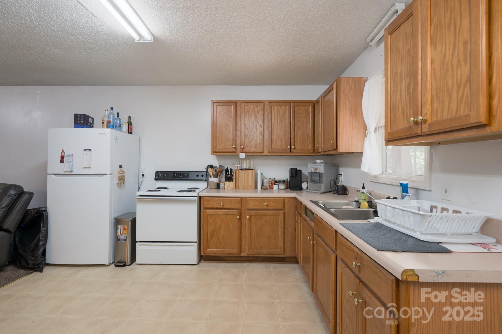 5624 Pleasant Avenue, Unit 3 Fort Lawn, SC 29714 - Photo 14 of 24 a kitchen with cabinets appliances a sink and a counter top space
