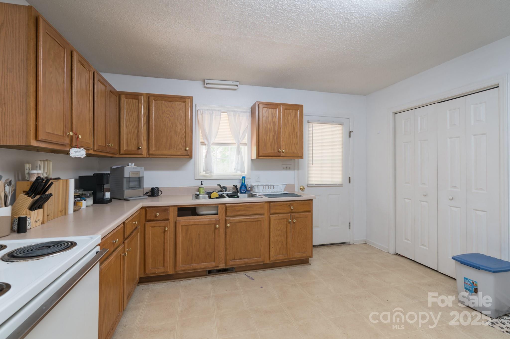 5624 Pleasant Avenue, Unit 3 Fort Lawn, SC 29714 - Photo 15 of 24 a kitchen with granite countertop a sink stove and cabinets