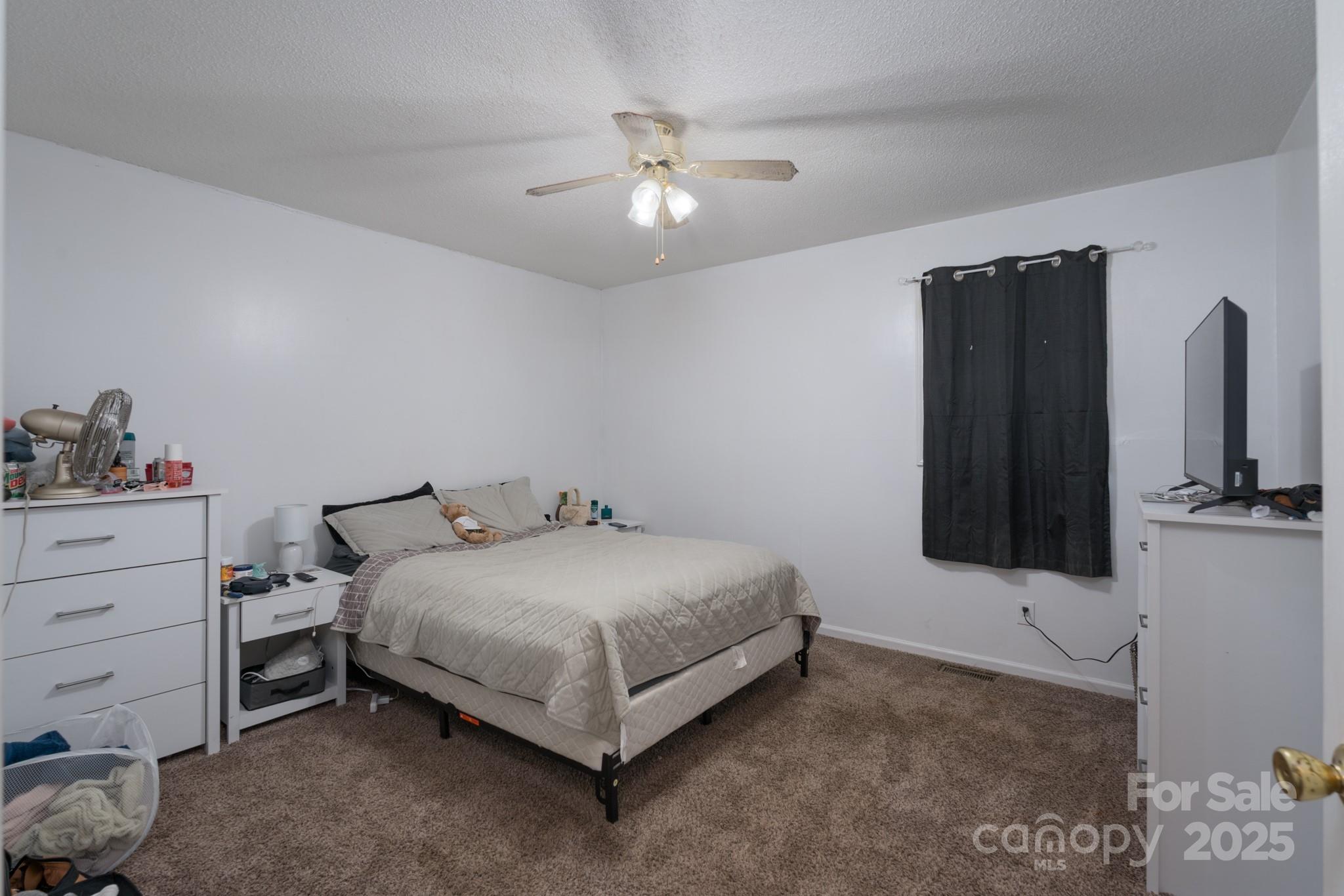 5624 Pleasant Avenue, Unit 3 Fort Lawn, SC 29714 - Photo 18 of 24 a bed room with a bed and a television