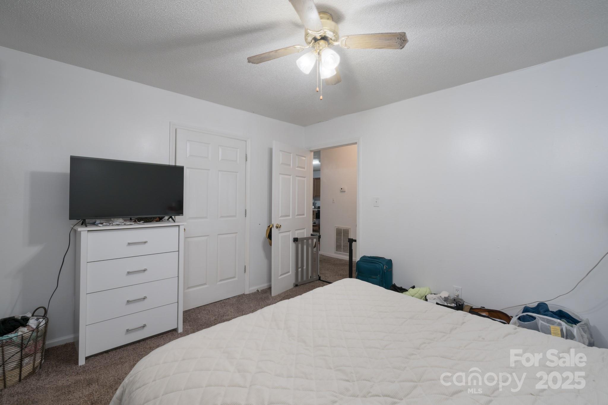 5624 Pleasant Avenue, Unit 3 Fort Lawn, SC 29714 - Photo 19 of 24 a bedroom with a bed and a flat screen tv