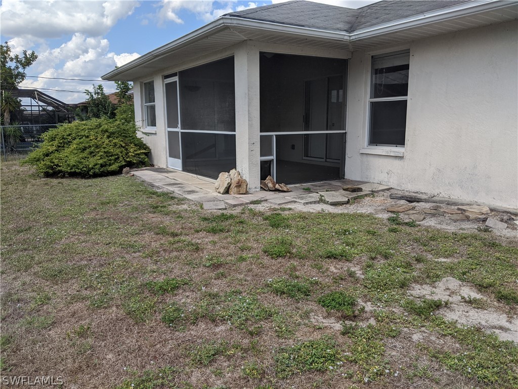 17496 Fuchsia Road Fort Myers, FL 33967 - Photo 8 of 9 a house with trees in front of it