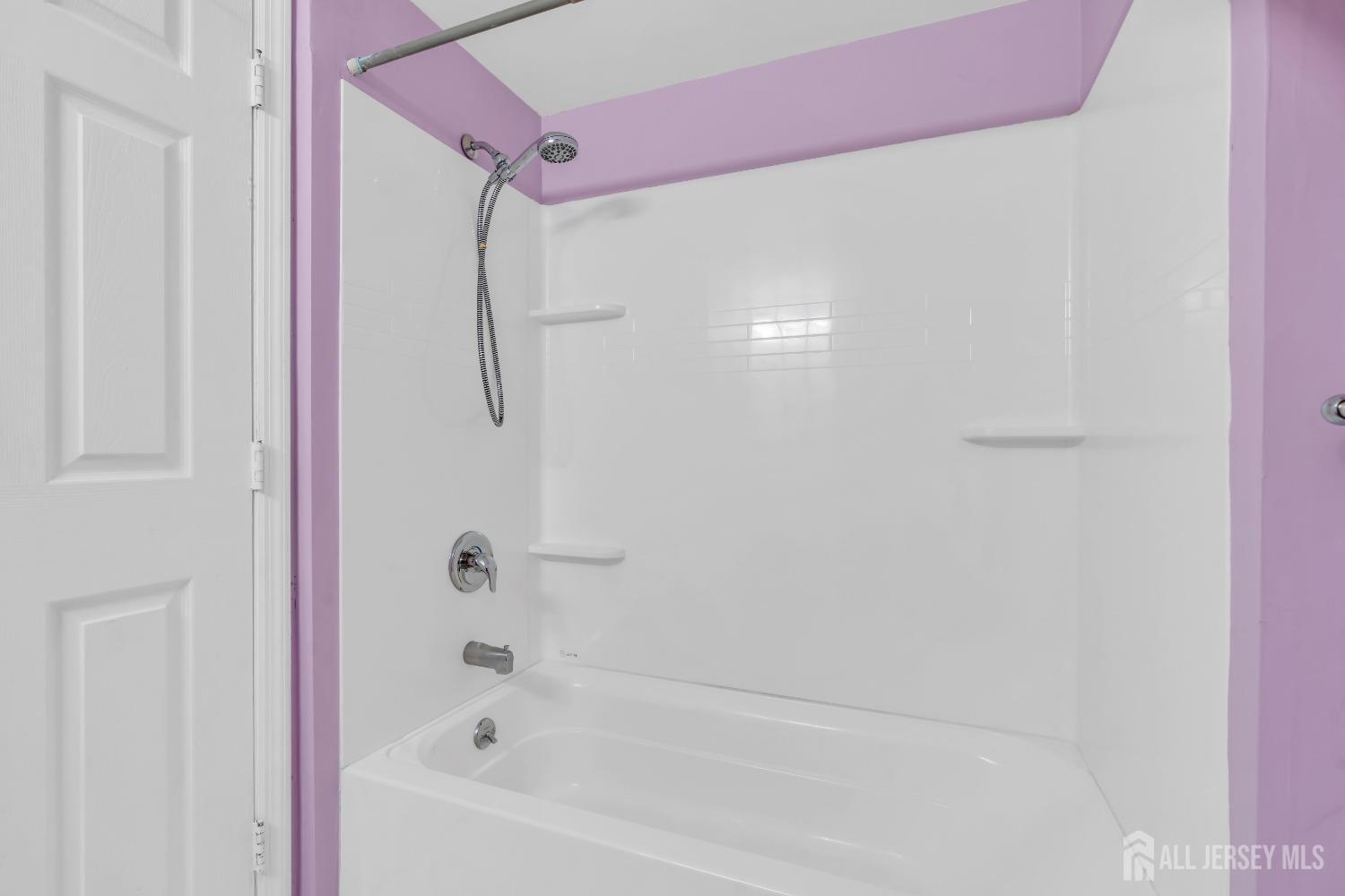 1014 Edpas Road New Brunswick, NJ 08901 - Photo 17 of 27 a bathroom with a bathtub and shower
