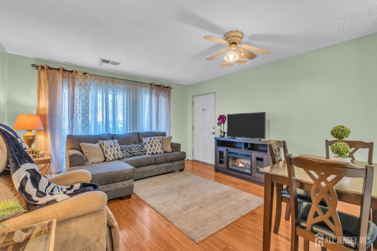 1014 Edpas Road New Brunswick, NJ 08901 - Photo 5 of 27 a living room with furniture and a flat screen tv