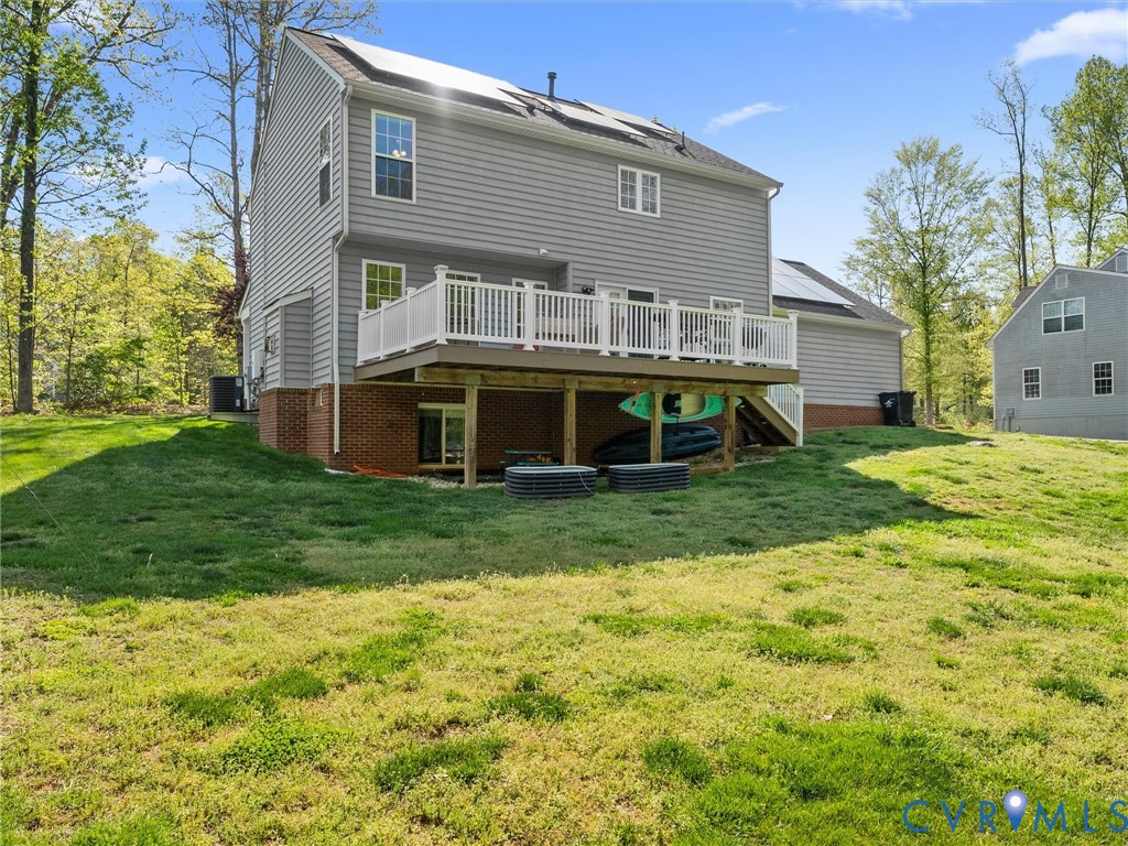 126 Reedy Creek Road Louisa, VA 23093 - Photo 61 of 68 The property features a spacious deck with white r