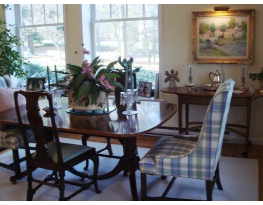 63 Garden Road, Unit G5 Wellesley, MA 02481 - Photo 11 of 19 a view of a dining room with furniture window and outside view