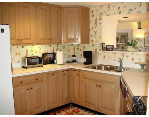63 Garden Road, Unit G5 Wellesley, MA 02481 - Photo 12 of 19 a kitchen with a sink cabinets and appliances