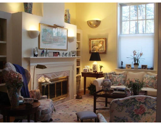 63 Garden Road, Unit G5 Wellesley, MA 02481 - Photo 2 of 19 a living room with furniture and a fireplace