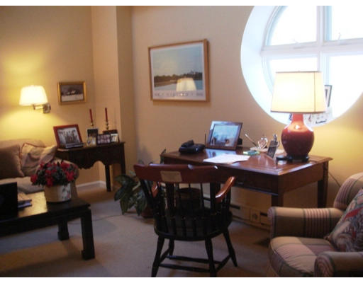 63 Garden Road, Unit G5 Wellesley, MA 02481 - Photo 5 of 19 a view of a dining room with furniture and wooden floor