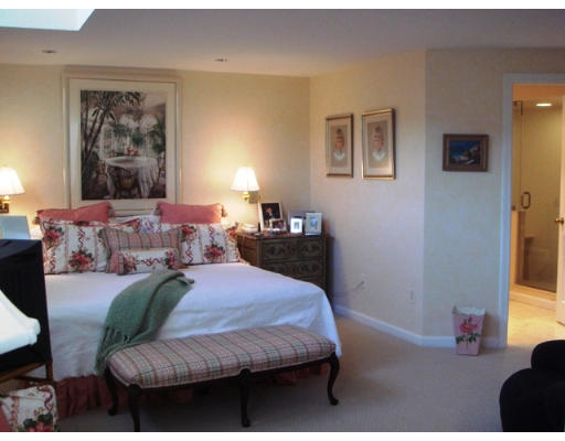 63 Garden Road, Unit G5 Wellesley, MA 02481 - Photo 6 of 19 a bedroom with a bed and wooden floor