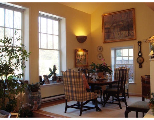 63 Garden Road, Unit G5 Wellesley, MA 02481 - Photo 10 of 19 a view of a dining room with furniture and chandelier