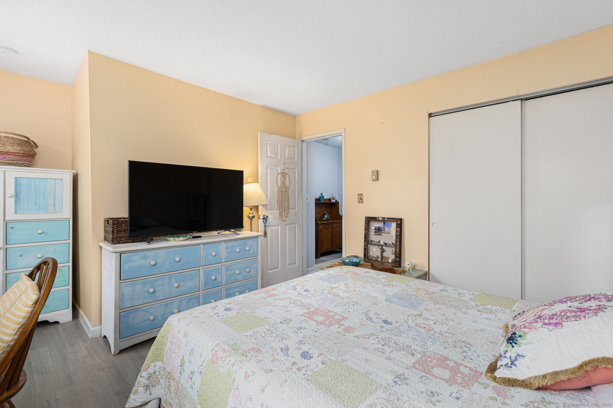 48 Athol Street, Unit 48 Killingly, CT 06239 - Photo 13 of 23 a bedroom with a bed and a flat screen tv