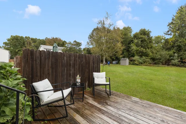 a view of a chair and table on the wooden floor