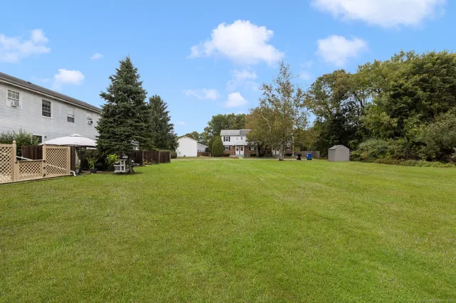 a view of a tree in front of a house