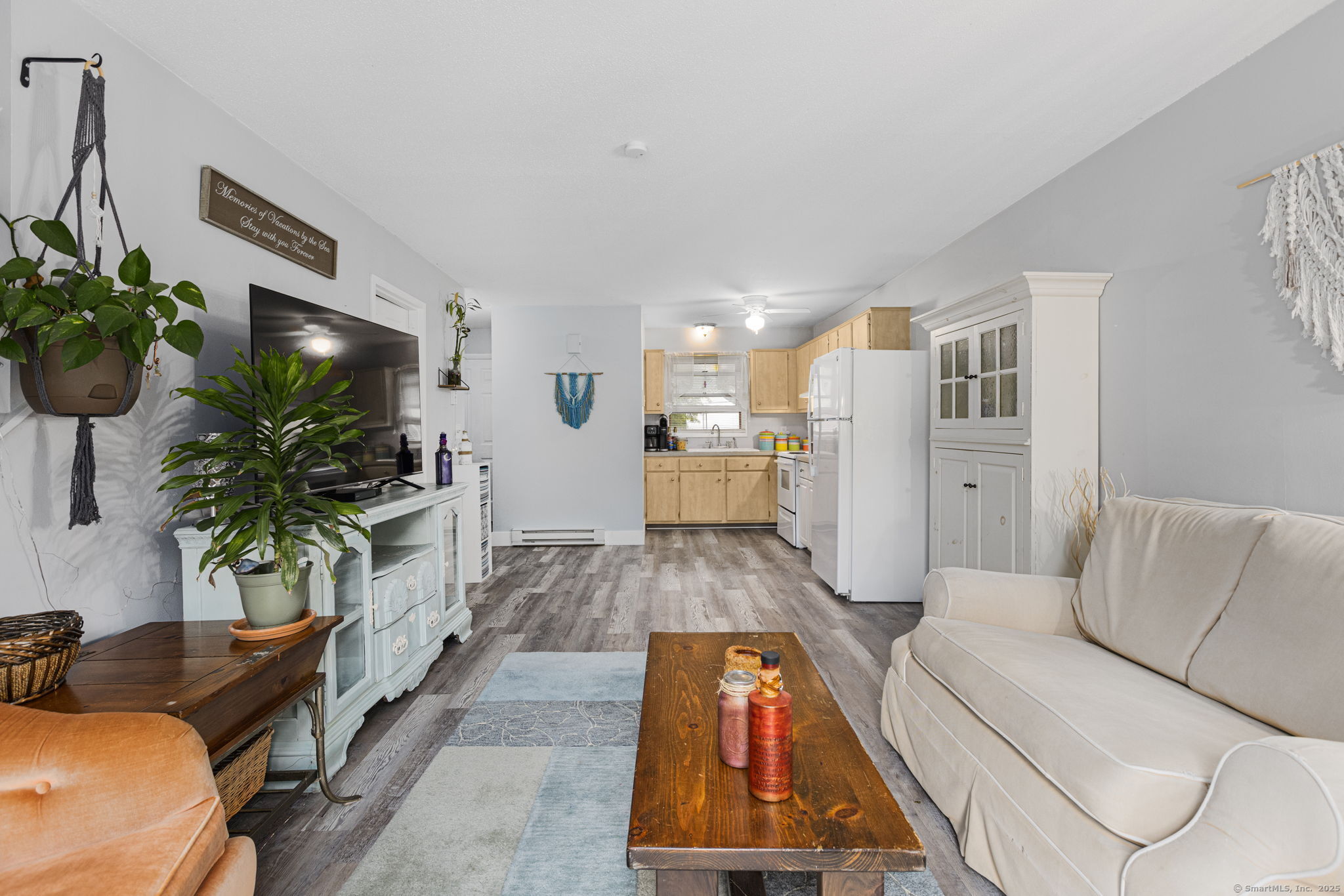 48 Athol Street, Unit 48 Killingly, CT 06239 - Photo 6 of 23 a living room with furniture and a potted plant