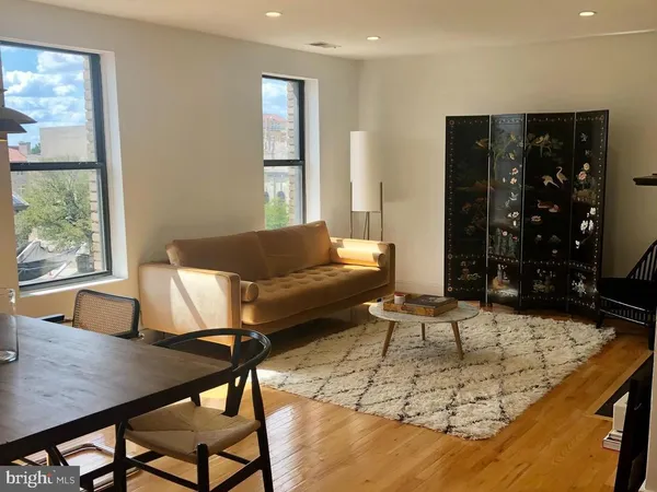 a living room with furniture and window