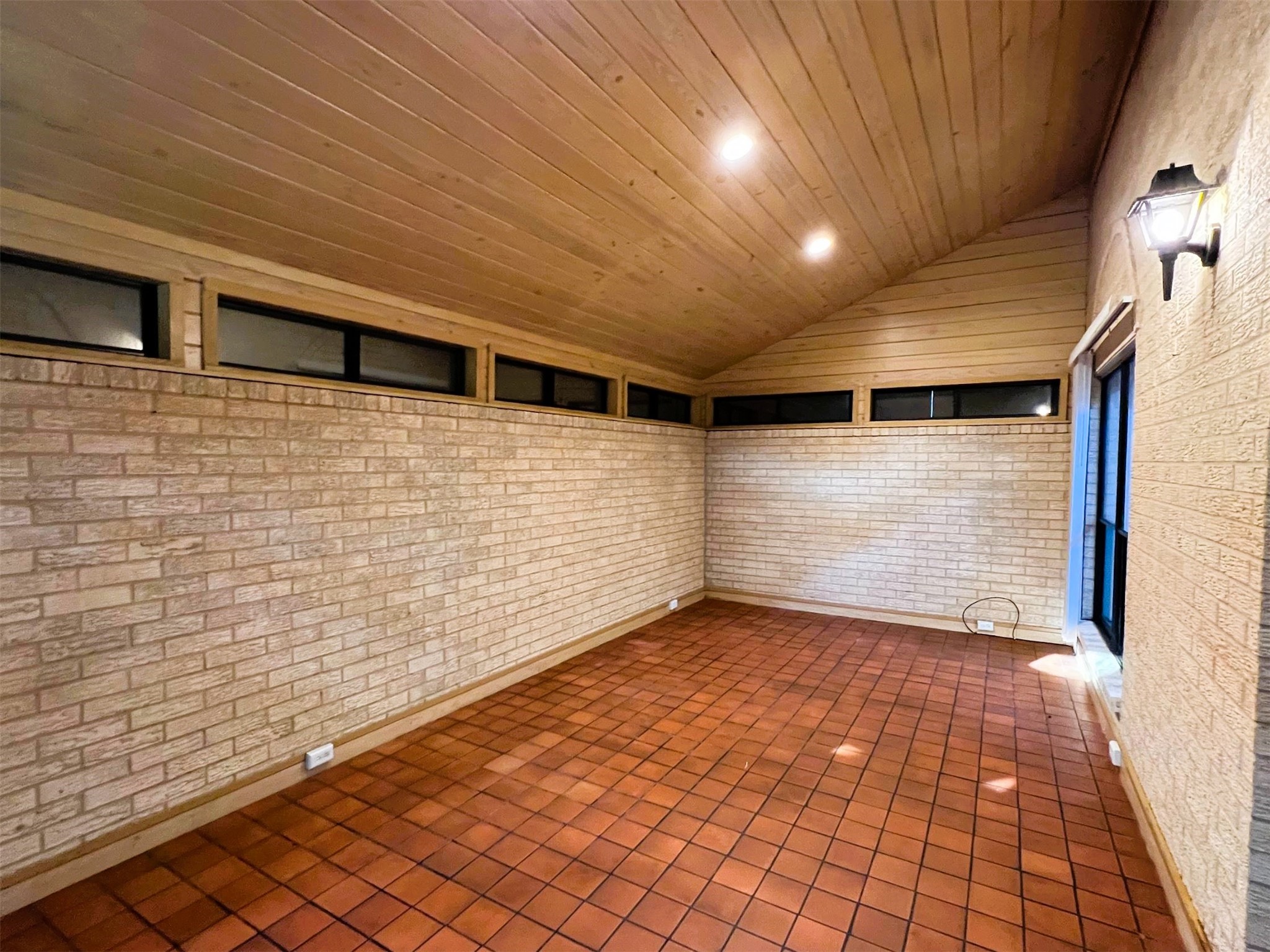 102 Briar Ridge Drive Bellville, TX 77418 - Photo 9 of 15 a view of a hallway with brick walls