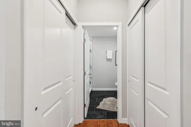 a view of a bathroom from a hallway