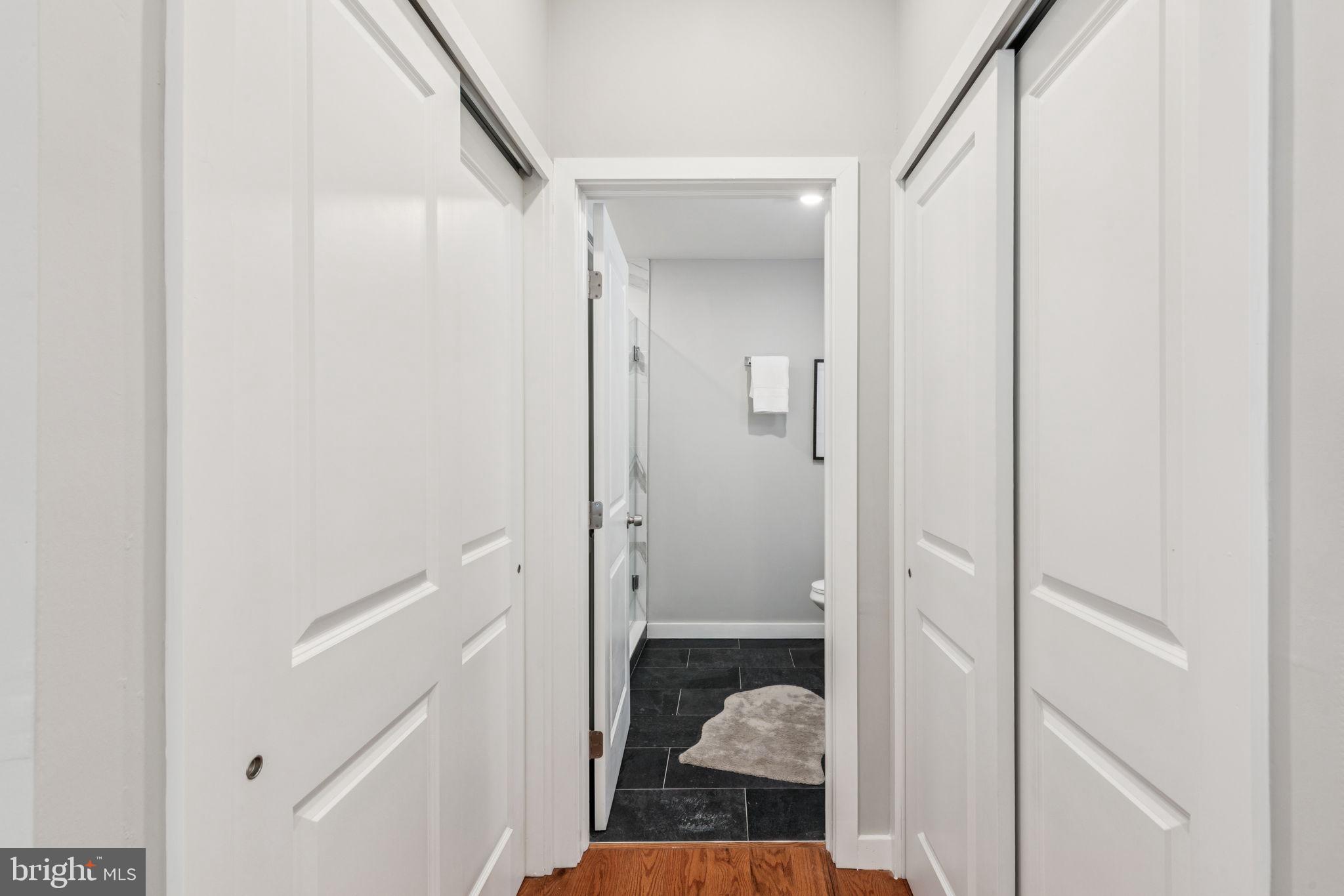 203 Haverford Avenue, Unit 208 Narberth, PA 19072 - Photo 29 of 35 a view of a bathroom from a hallway