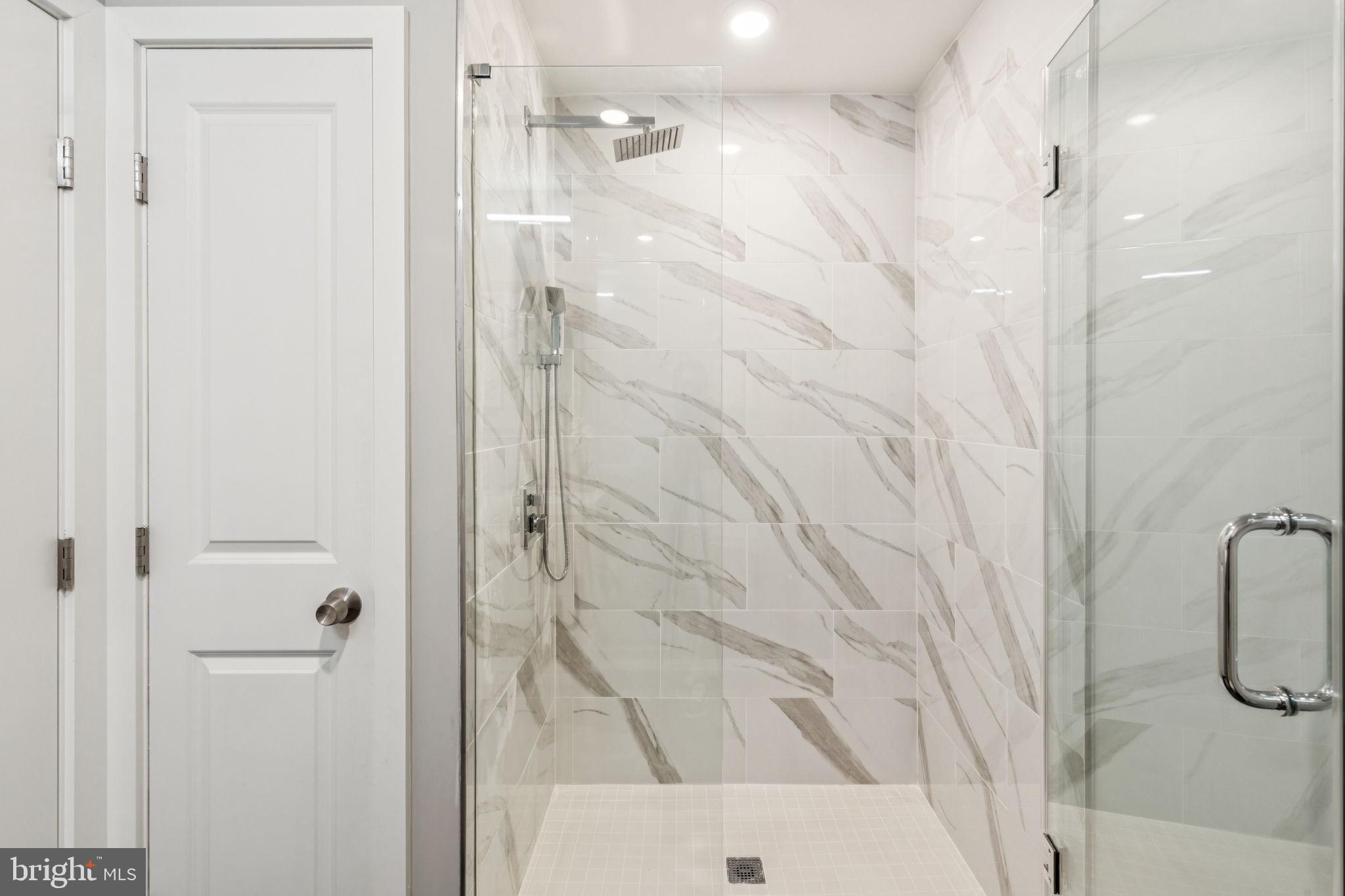 203 Haverford Avenue, Unit 208 Narberth, PA 19072 - Photo 31 of 35 a bathroom with a shower