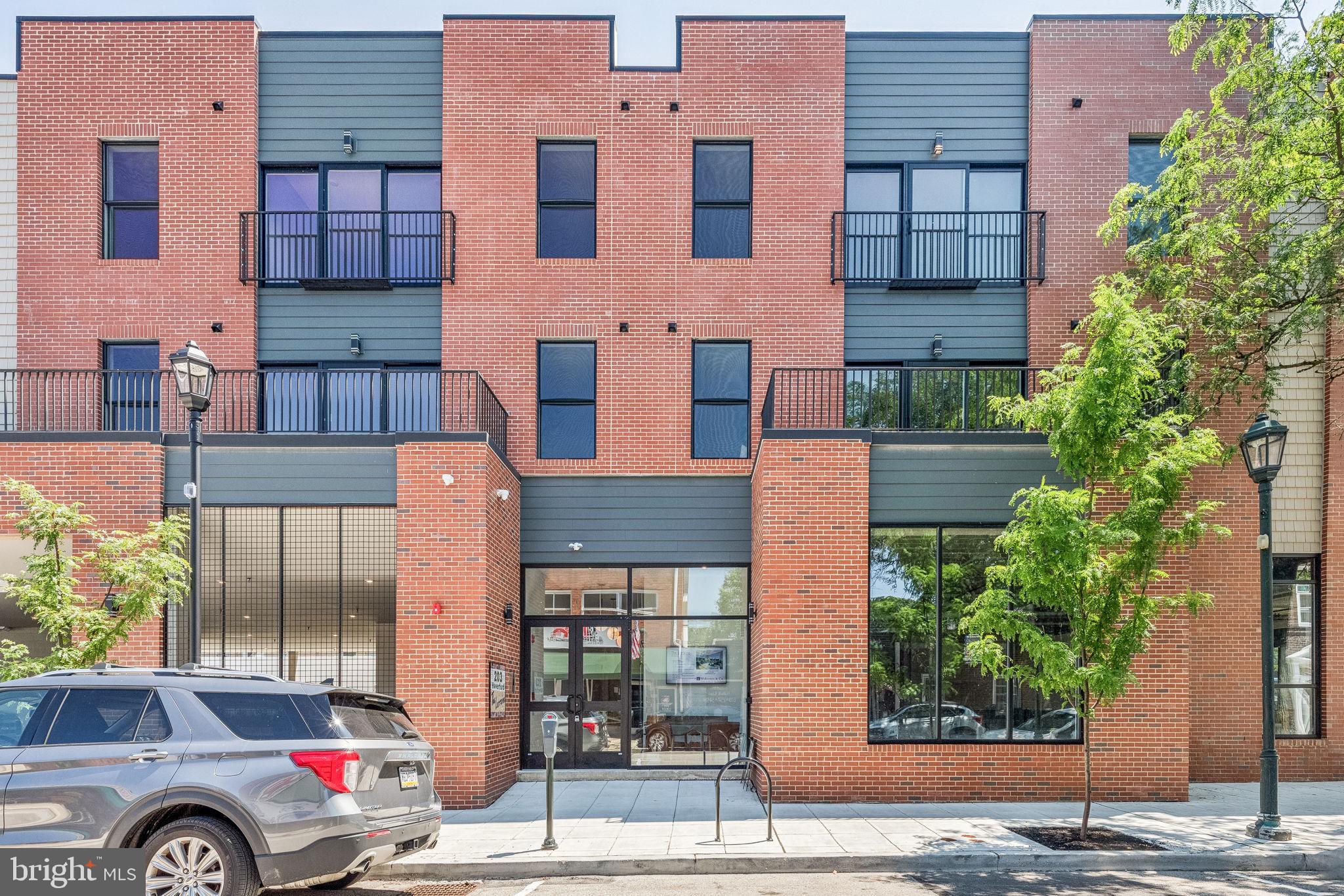 203 Haverford Avenue, Unit 208 Narberth, PA 19072 - Photo 32 of 35 front view of a building with a street