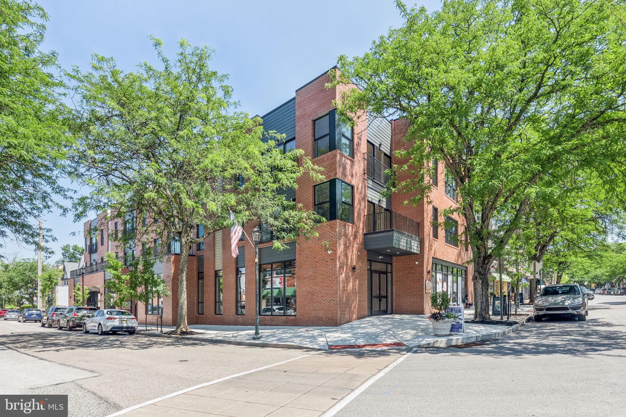203 Haverford Avenue, Unit 208 Narberth, PA 19072 - Photo 35 of 35 a street corner with a building in the background