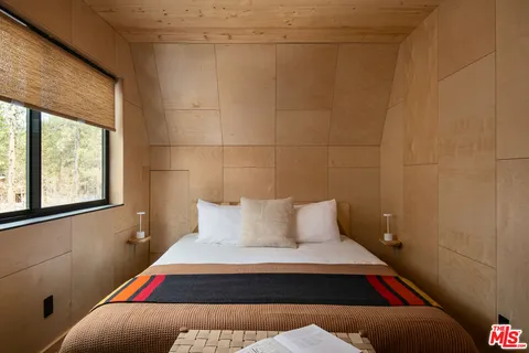 a room with a bed and window