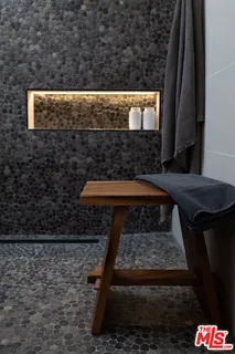 a living room with a toilet and a shower