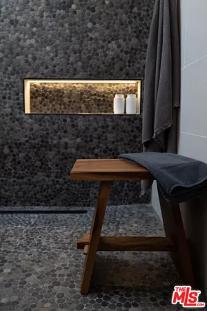 a living room with a toilet and a shower