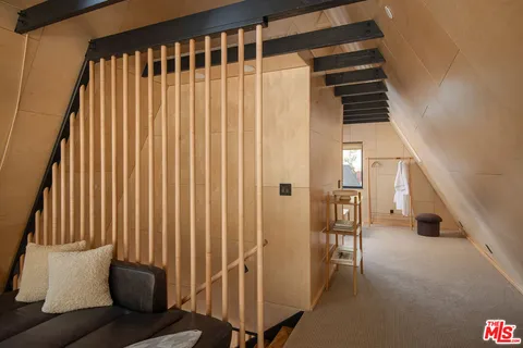 a view of a hallway with seating area