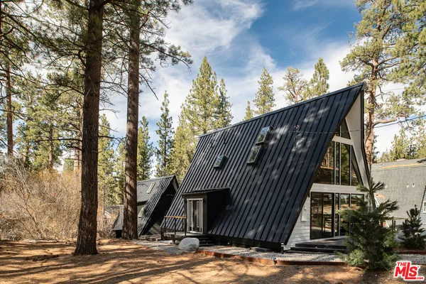 a view of outdoor space deck and mountain view in back yard