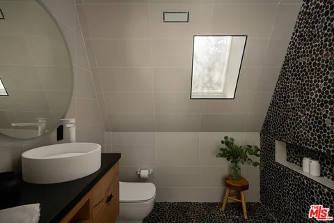 a bathroom with a toilet and sink