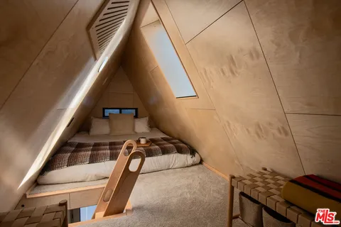 a view of staircase with wooden floor