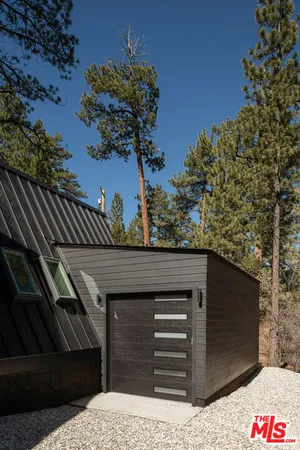 a view of front door with furniture and a window