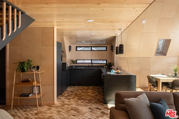 a kitchen with a sink appliances and cabinets