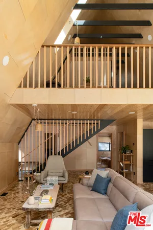 a balcony with table and chairs