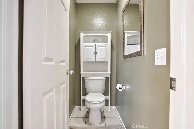 a spacious bathroom with a shower sink and mirror