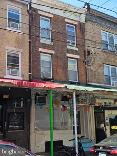 a view of street with an entrance and a building