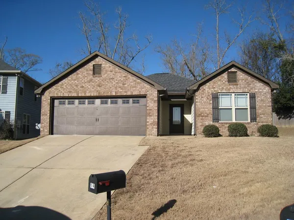 a front view of a house with yard
