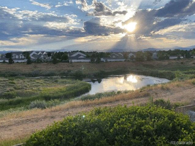 a view of lake with green space