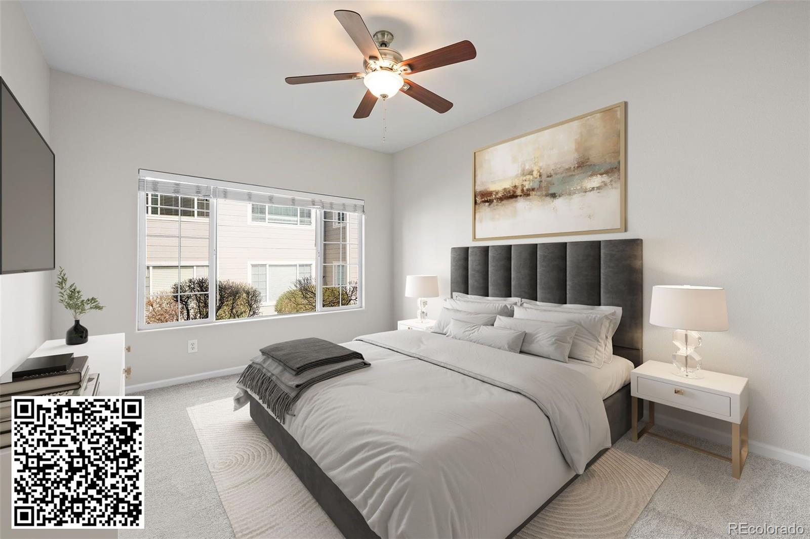 8389 Pebble Creek Way, Unit 101 Highlands Ranch, CO 80126 - Photo 13 of 44 a bedroom with a large bed and a large window