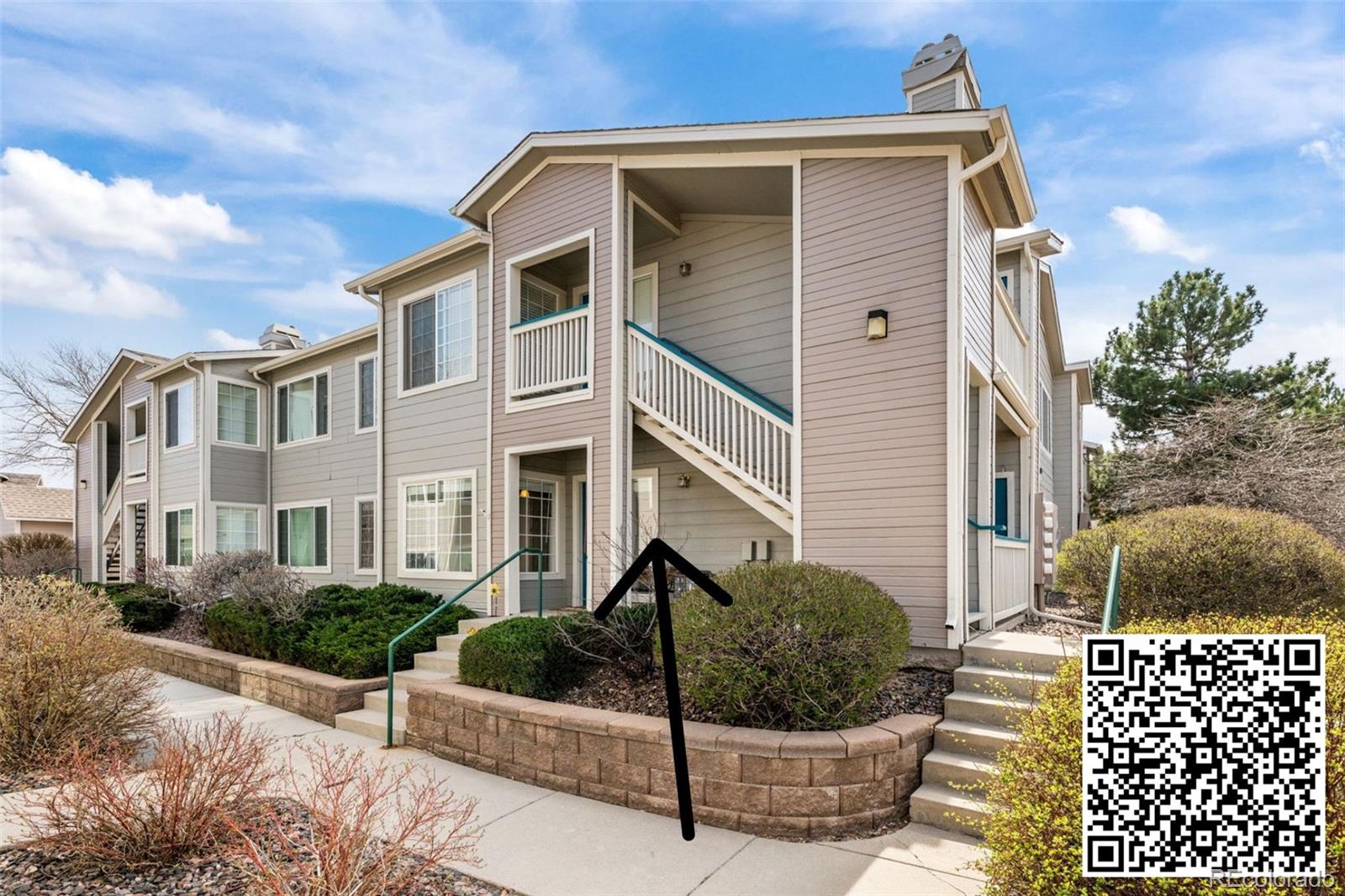 8389 Pebble Creek Way, Unit 101 Highlands Ranch, CO 80126 - Photo 26 of 44 a view of a white building among the street
