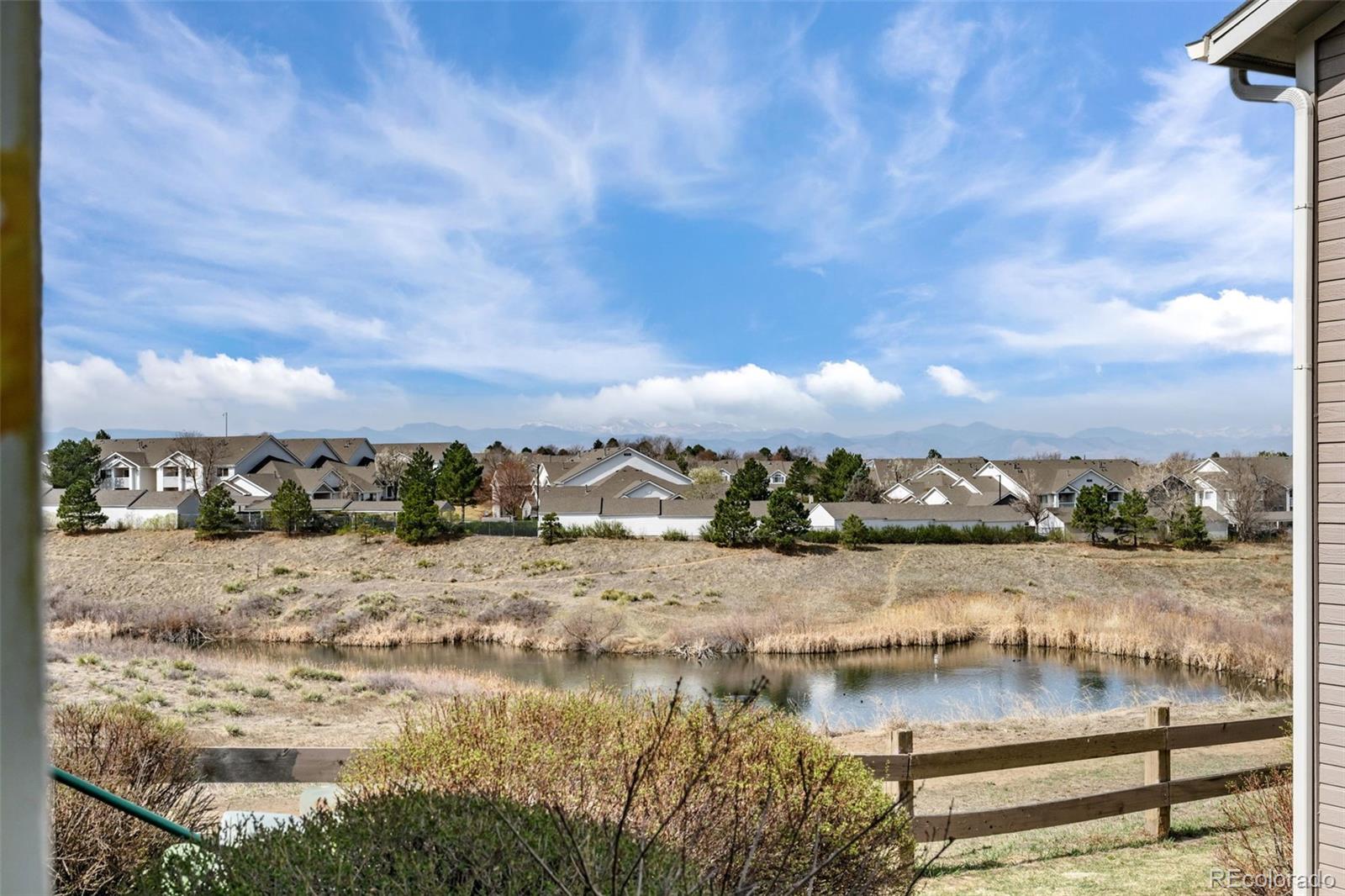 8389 Pebble Creek Way, Unit 101 Highlands Ranch, CO 80126 - Photo 28 of 44 a view of lake view and mountain