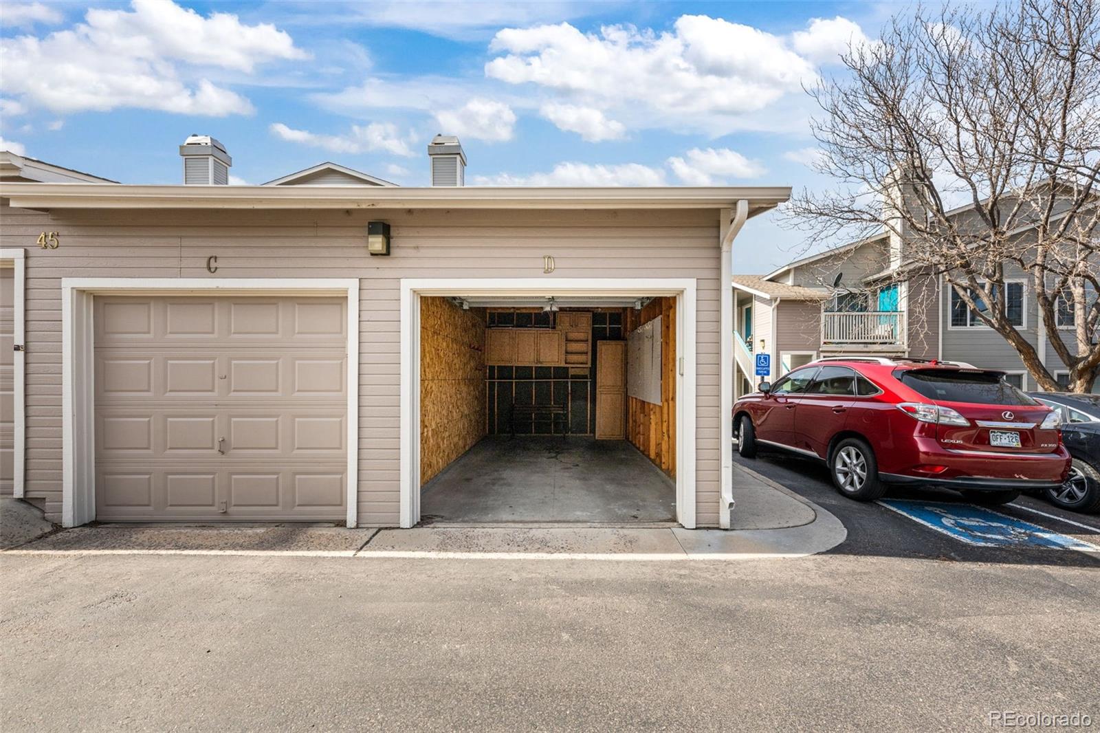 8389 Pebble Creek Way, Unit 101 Highlands Ranch, CO 80126 - Photo 31 of 44 a view of garage with a car parked in it