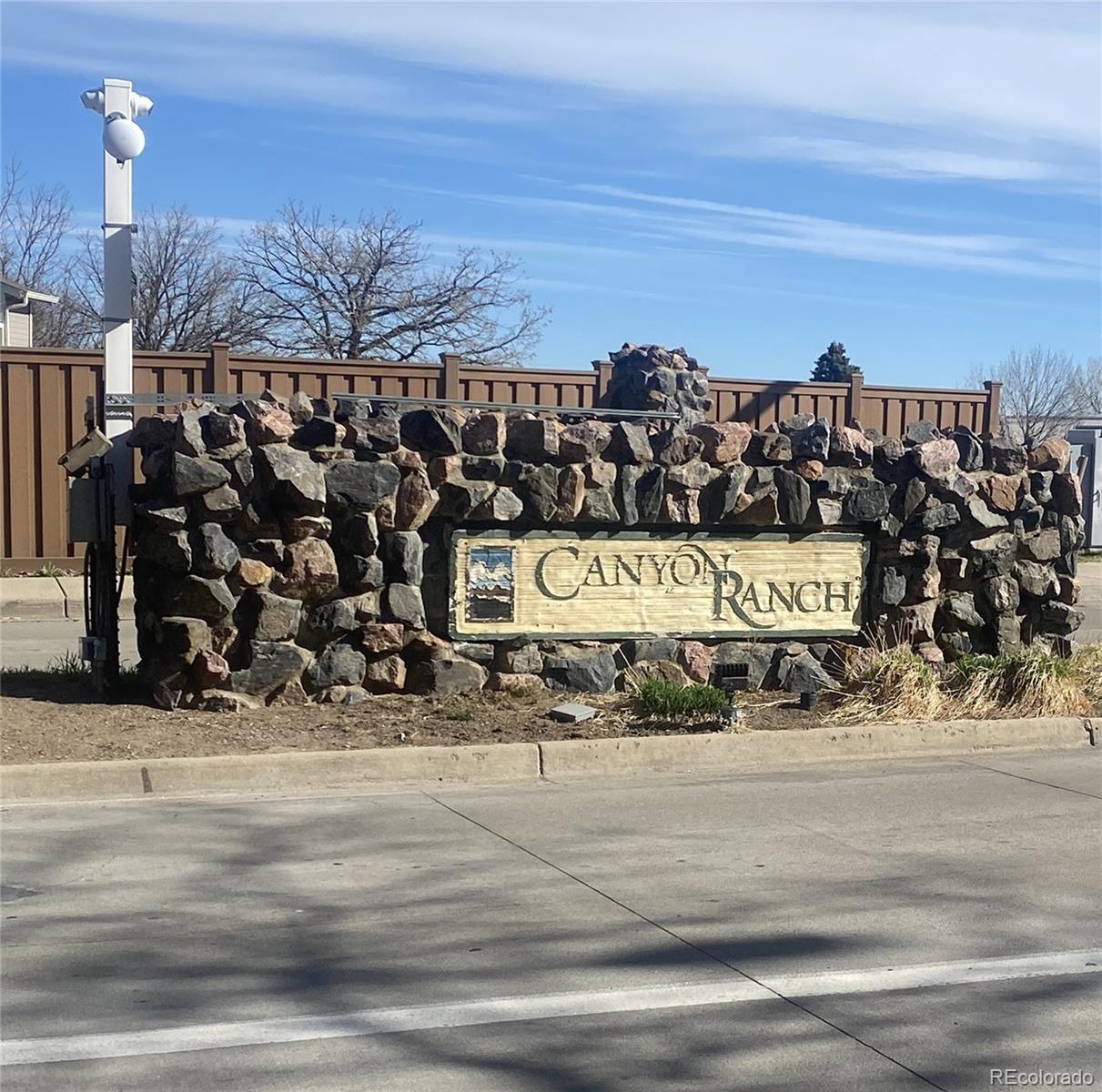 8389 Pebble Creek Way, Unit 101 Highlands Ranch, CO 80126 - Photo 38 of 44 a view of a street with a building