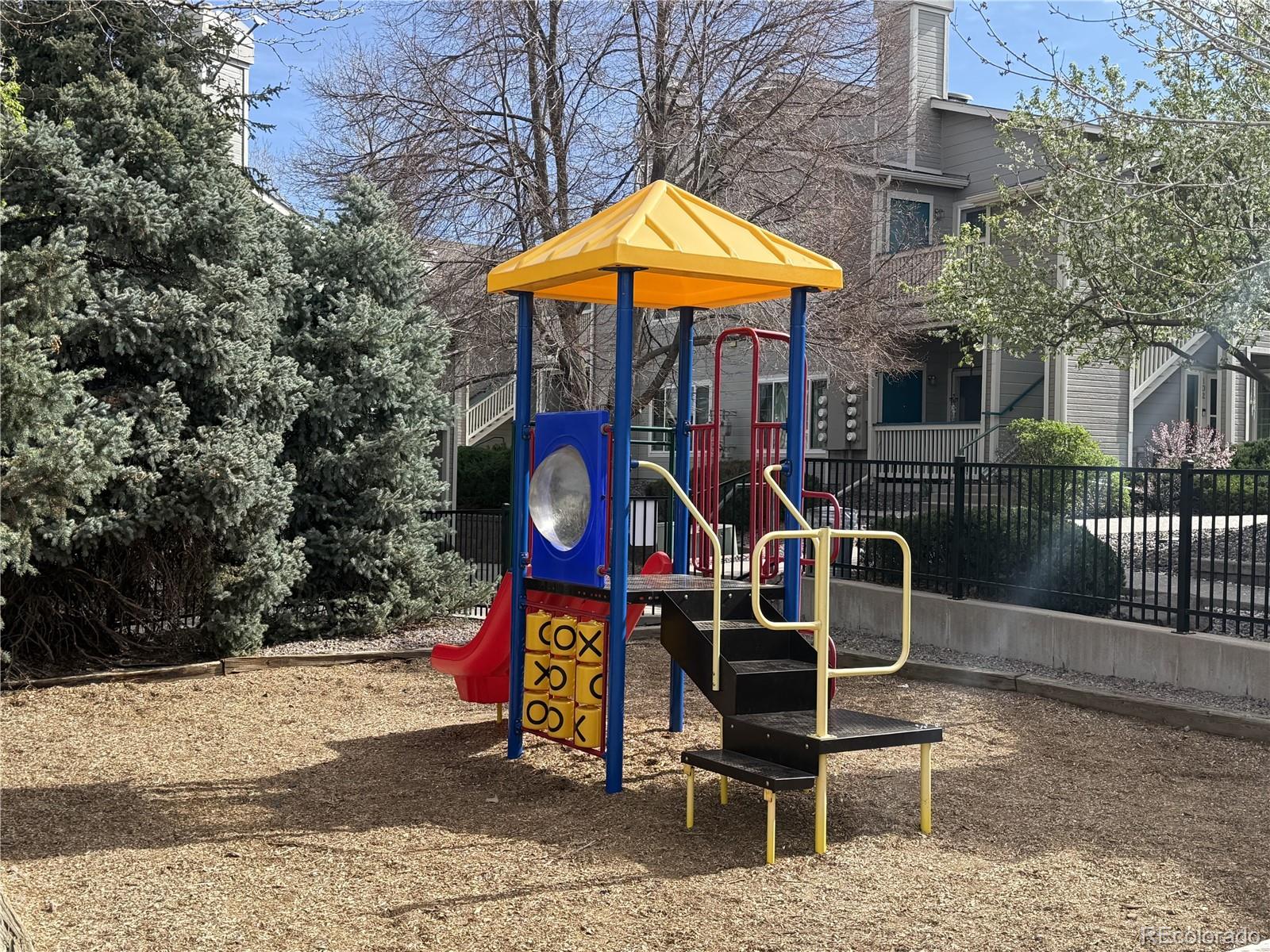 8389 Pebble Creek Way, Unit 101 Highlands Ranch, CO 80126 - Photo 41 of 44 a sign on the wall of a building
