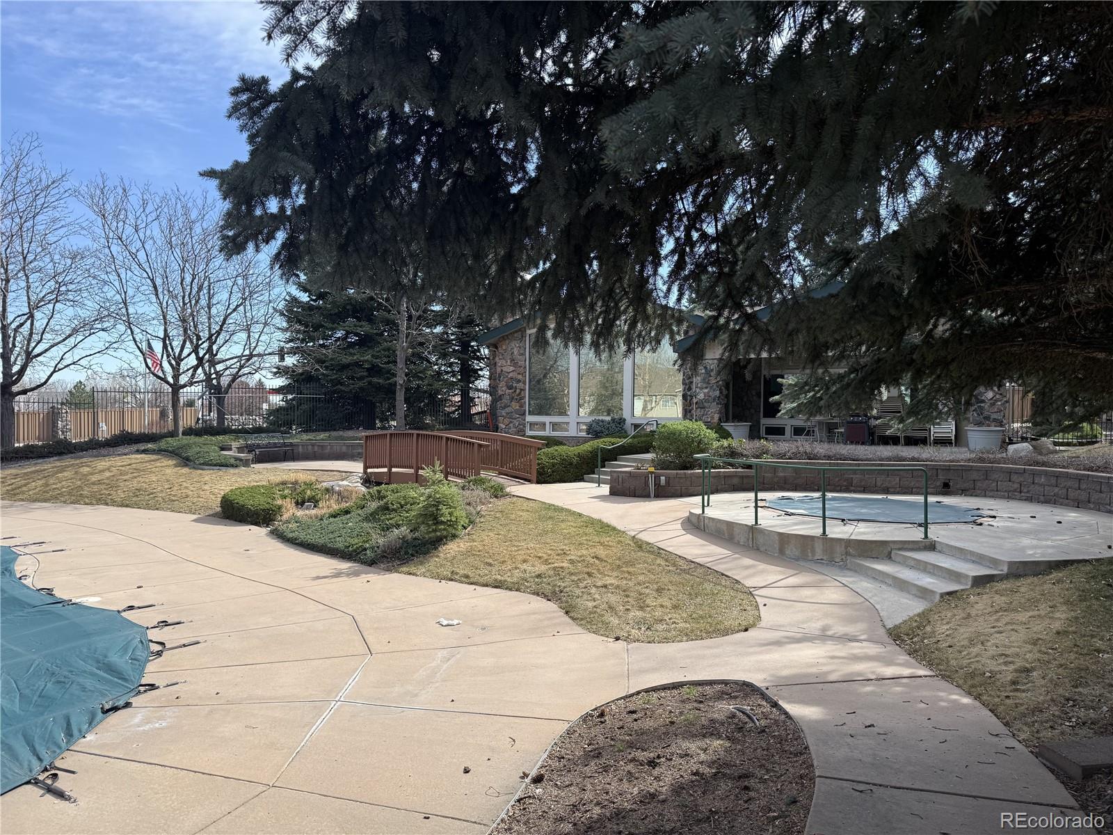 8389 Pebble Creek Way, Unit 101 Highlands Ranch, CO 80126 - Photo 42 of 44 a view of a yard with plants and trees