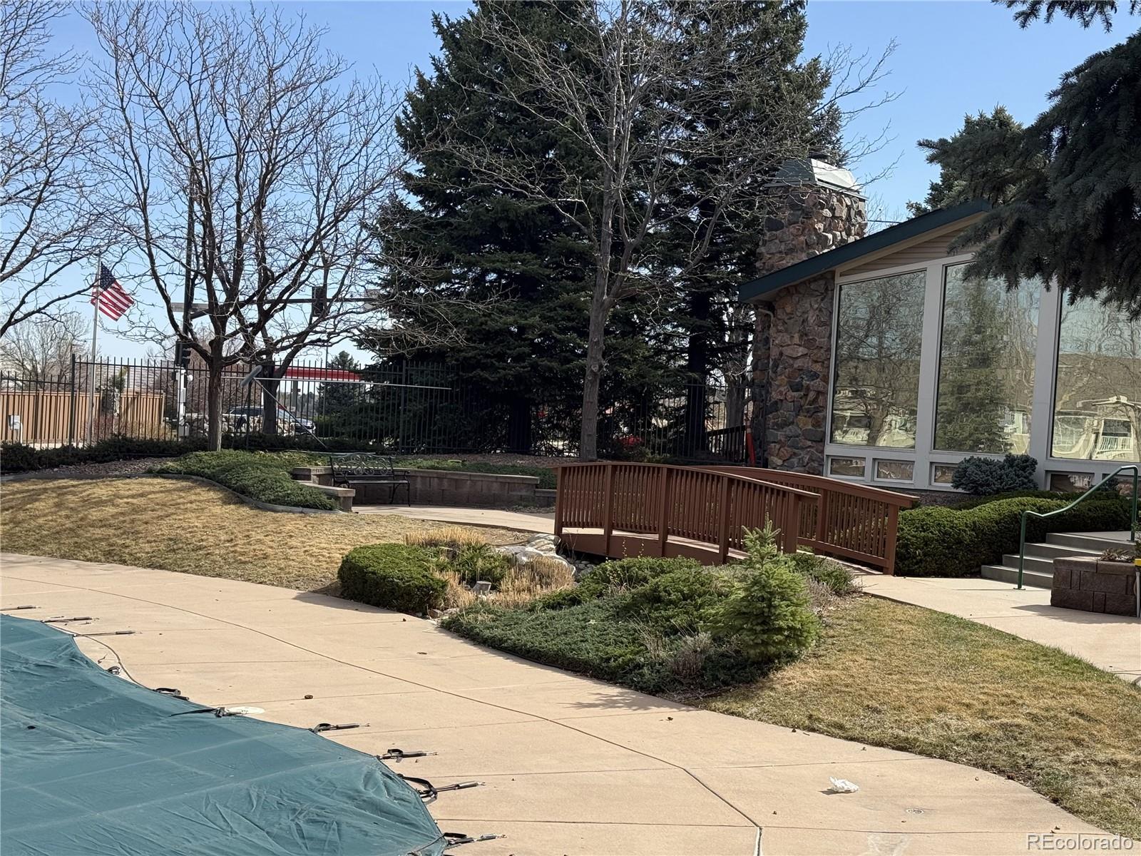 8389 Pebble Creek Way, Unit 101 Highlands Ranch, CO 80126 - Photo 43 of 44 a view of backyard with outdoor seating and plants