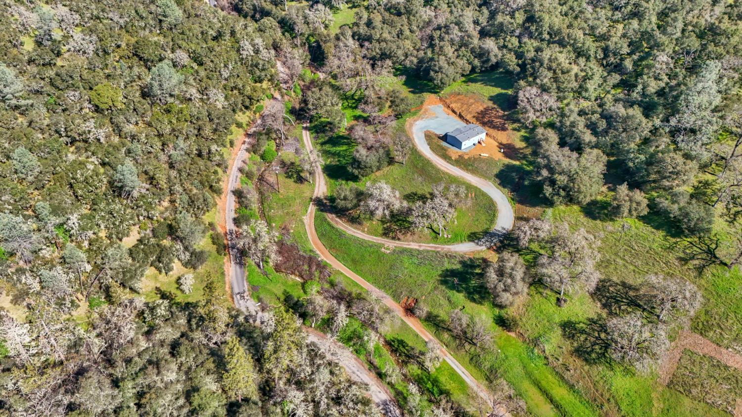 7680 Middle Bar Road Jackson, CA 95642 - Photo 14 of 58 an aerial view of a house with a yard and outdoor seating